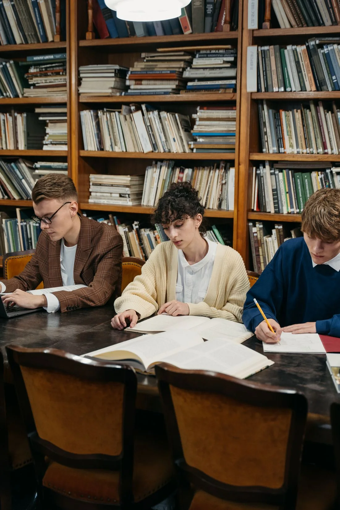 Students working together at a library table